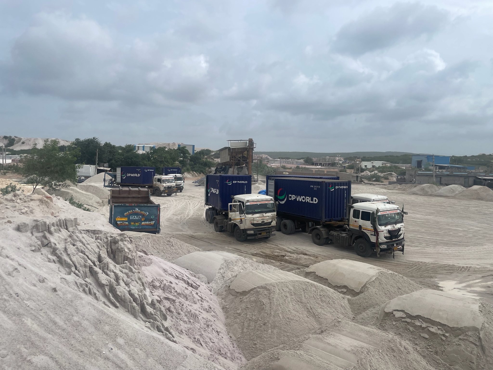 Mining site machinery operating at sunrise